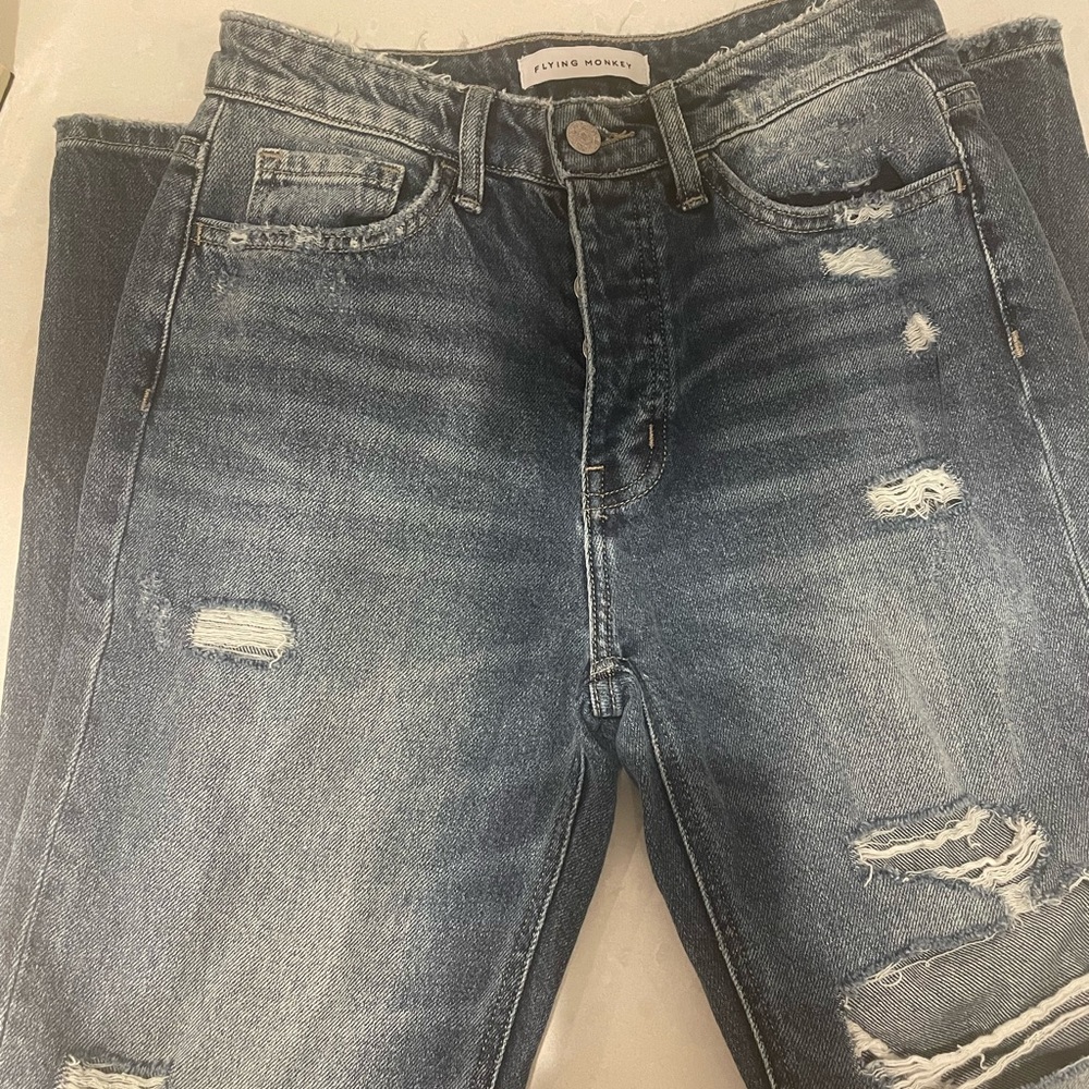 Flying Monkey distressed, medium wash, loose fitting jeans.